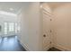 Hallway leading to a glass front door with sidelights, providing a bright entryway at 4075 O Henry Ct, Mcdonough, GA 30252