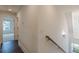 Hallway with a view into another room with a window and a staircase on the right at 4075 O Henry Ct, Mcdonough, GA 30252