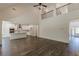 Open-concept living area with soaring ceilings, wood floors, and views of the kitchen and entryway at 4075 O Henry Ct, Mcdonough, GA 30252