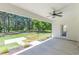 Covered back patio with ceiling fan and concrete flooring, offering a relaxing outdoor living space at 4075 O Henry Ct, Mcdonough, GA 30252
