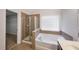 Modern bathroom showcasing a glass-enclosed shower, a tub, and tile accents at 436 Crestmont Ln, Canton, GA 30114