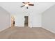Spacious bedroom featuring neutral walls, plush carpet, and a ceiling fan for added comfort at 436 Crestmont Ln, Canton, GA 30114