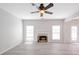 Living room features a fireplace, neutral walls, vinyl floors, and a modern ceiling fan at 436 Crestmont Ln, Canton, GA 30114