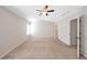 Spacious main bedroom with neutral walls, a ceiling fan, and carpeting at 436 Crestmont Ln, Canton, GA 30114