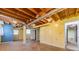 Unfinished basement with exposed ductwork, painted walls, and concrete floors, offering potential for customization at 5166 Vivid Dr, Stone Mountain, GA 30087