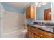 Bathroom with a tub and granite countertop sink at 5166 Vivid Dr, Stone Mountain, GA 30087