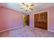 Bedroom with a closet and a ceiling fan at 5166 Vivid Dr, Stone Mountain, GA 30087