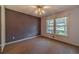 Bedroom with large windows overlooking front yard at 5166 Vivid Dr, Stone Mountain, GA 30087