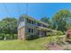 Charming two-story home with brick and siding exterior, complemented by a well-manicured lawn at 5166 Vivid Dr, Stone Mountain, GA 30087