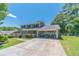 Charming two-story home with a two car garage, complemented by a well-maintained lawn and mature trees at 5166 Vivid Dr, Stone Mountain, GA 30087