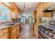 Well-lit kitchen with granite countertops, tile backsplash, and tile flooring, with sight lines to the Gathering room at 5166 Vivid Dr, Stone Mountain, GA 30087