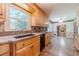 Kitchen featuring granite countertops, stainless steel appliances, and tile backsplash with convenient access to the Gathering room at 5166 Vivid Dr, Stone Mountain, GA 30087