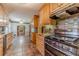 Spacious kitchen with stainless steel appliances, granite countertops, and tile flooring at 5166 Vivid Dr, Stone Mountain, GA 30087
