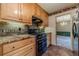 Updated kitchen featuring granite countertops, stainless steel appliances, and tile backsplash at 5166 Vivid Dr, Stone Mountain, GA 30087