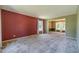 Spacious living room featuring neutral carpet and a window with natural light streaming in at 5166 Vivid Dr, Stone Mountain, GA 30087
