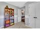 A bedroom featuring a bookshelf, and an open door that leads to a hallway at 940 Planters Pl, Loganville, GA 30052