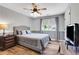 Bedroom with wood floors, neutral paint, a ceiling fan, and lots of natural light at 940 Planters Pl, Loganville, GA 30052