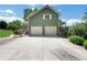 Home exterior featuring an attached garage and a concrete driveway at 940 Planters Pl, Loganville, GA 30052