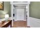 Welcoming foyer with hardwood floors and elegant trim details at 940 Planters Pl, Loganville, GA 30052