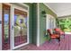 Inviting front porch featuring comfortable seating and a charming exterior view at 940 Planters Pl, Loganville, GA 30052