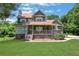 Charming two-story home with a well-manicured front yard and inviting covered porch at 940 Planters Pl, Loganville, GA 30052