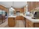 Bright kitchen featuring stainless appliances, tiled floors, and a center island is ideal for everyday cooking and casual dining at 940 Planters Pl, Loganville, GA 30052