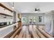 Open kitchen featuring wood floors, stainless steel appliances, and a breakfast bar at 940 Planters Pl, Loganville, GA 30052