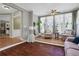Charming living room with ample natural light, hardwood floors and neutral decor creates a bright and welcoming atmosphere at 940 Planters Pl, Loganville, GA 30052