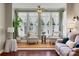 Inviting living room with large windows and comfortable seating area at 940 Planters Pl, Loganville, GA 30052