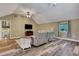 Cozy living room featuring wood floors, a ceiling fan, and a comfortable recliner at 940 Planters Pl, Loganville, GA 30052