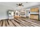 Spacious living area with wood floors, featuring stainless steel refrigerator at 940 Planters Pl, Loganville, GA 30052