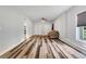 Bright room with wood floors and tan sofa at 940 Planters Pl, Loganville, GA 30052