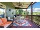 Covered patio with outdoor seating and vibrant rug at 940 Planters Pl, Loganville, GA 30052