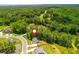 Scenic aerial view features homes nestled among the trees in a quiet neighborhood at 1013 Liberty Springs Dr, Woodstock, GA 30188