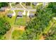 A sprawling property showcases lush lawns, privacy fencing, and mature trees, creating an inviting outdoor space at 1013 Liberty Springs Dr, Woodstock, GA 30188