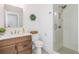 Well-lit bathroom features a glass shower enclosure and a clean, white vanity with a modern sink at 1013 Liberty Springs Dr, Woodstock, GA 30188