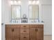 Bathroom featuring a double vanity with modern fixtures and ample storage space at 1013 Liberty Springs Dr, Woodstock, GA 30188