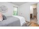 Bedroom featuring a comfortable bed and an ensuite bathroom, offering a private retreat at 1013 Liberty Springs Dr, Woodstock, GA 30188