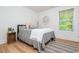 Cozy bedroom featuring a comfortable bed, stylish decor, and ample natural light at 1013 Liberty Springs Dr, Woodstock, GA 30188