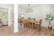 Bright and airy dining room with hardwood floors, modern chandelier, and ample space for entertaining guests at 1013 Liberty Springs Dr, Woodstock, GA 30188