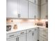 Close-up of the kitchen's countertop, cabinets, and appliances, showcasing the clean and stylish design at 1013 Liberty Springs Dr, Woodstock, GA 30188