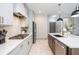 Modern eat-in kitchen featuring stainless steel appliances, sleek countertops, and ample cabinet space at 1013 Liberty Springs Dr, Woodstock, GA 30188