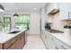 Contemporary kitchen featuring stainless steel appliances, sleek countertops, and modern fixtures at 1013 Liberty Springs Dr, Woodstock, GA 30188