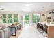 Bright living room with modern furnishings, sleek countertops, and a view to the outdoor deck at 1013 Liberty Springs Dr, Woodstock, GA 30188