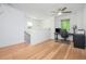 Bright office with hardwood floors, modern desk setup, and a ceiling fan at 1013 Liberty Springs Dr, Woodstock, GA 30188