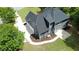 Aerial view of home exterior displaying the lawn, manicured yard, driveway, and roof at 219 Maple Creek, Woodstock, GA 30188