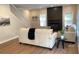 Cozy living room featuring a fireplace, staircase, and natural light from large windows at 219 Maple Creek, Woodstock, GA 30188