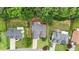 Aerial view of a home with a driveway, lush greenery, and neighboring properties, showcasing the landscape at 2949 Spotted Pony Nw Ct, Acworth, GA 30101