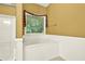 Bathroom features a jetted tub and a window for natural light at 2949 Spotted Pony Nw Ct, Acworth, GA 30101