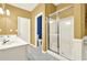 Well-lit bathroom featuring double sinks, walk-in shower and separate toilet room at 2949 Spotted Pony Nw Ct, Acworth, GA 30101